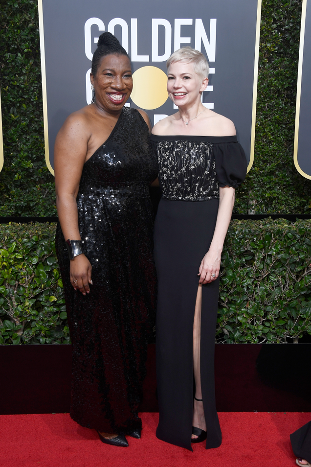 Tarana Burke (L) and Michelle Williams attend The 75th Annual Golden Globe Awards at The Beverly Hilton Hotel on January 7, 2018 in Beverly Hills, California.